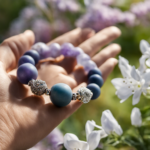An image of a serene hand wearing an aromatherapy bracelet adorned with delicate beads and a small diffuser, emitting a gentle mist of fragrant essential oils